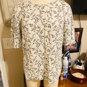 A new day brand White floral blouse used a couple of times doesn't fit anymore.